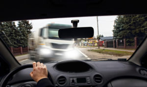 A car collides with a truck on a road in Georgia. 