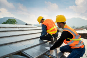 Roofers installing new CPAC roof.