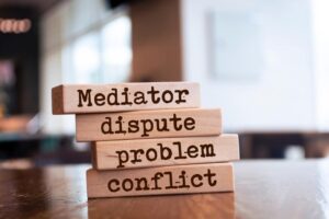 Mediator dispute problem conflict word blocks on the table