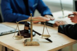 Lawyer gesturing with hands while discussing contract details with client